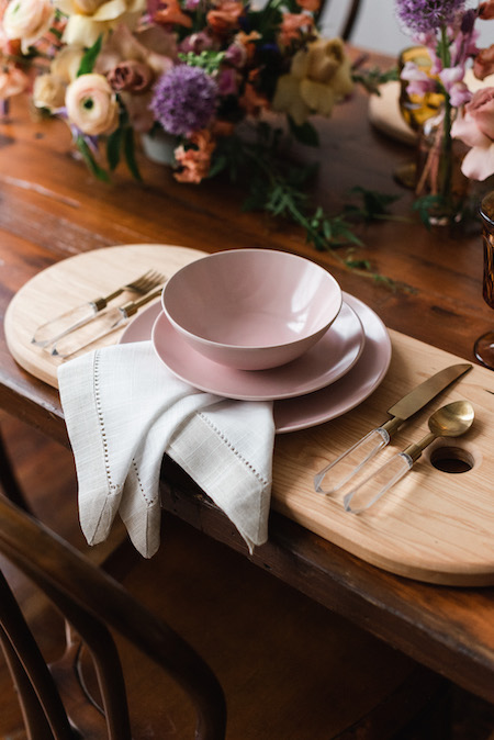 linen napkin with pink plate and acrylic silverware